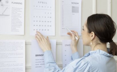 Woman in a Blue Top Looking at Paper