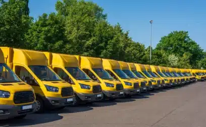 A fleet of business vans lined up in a row